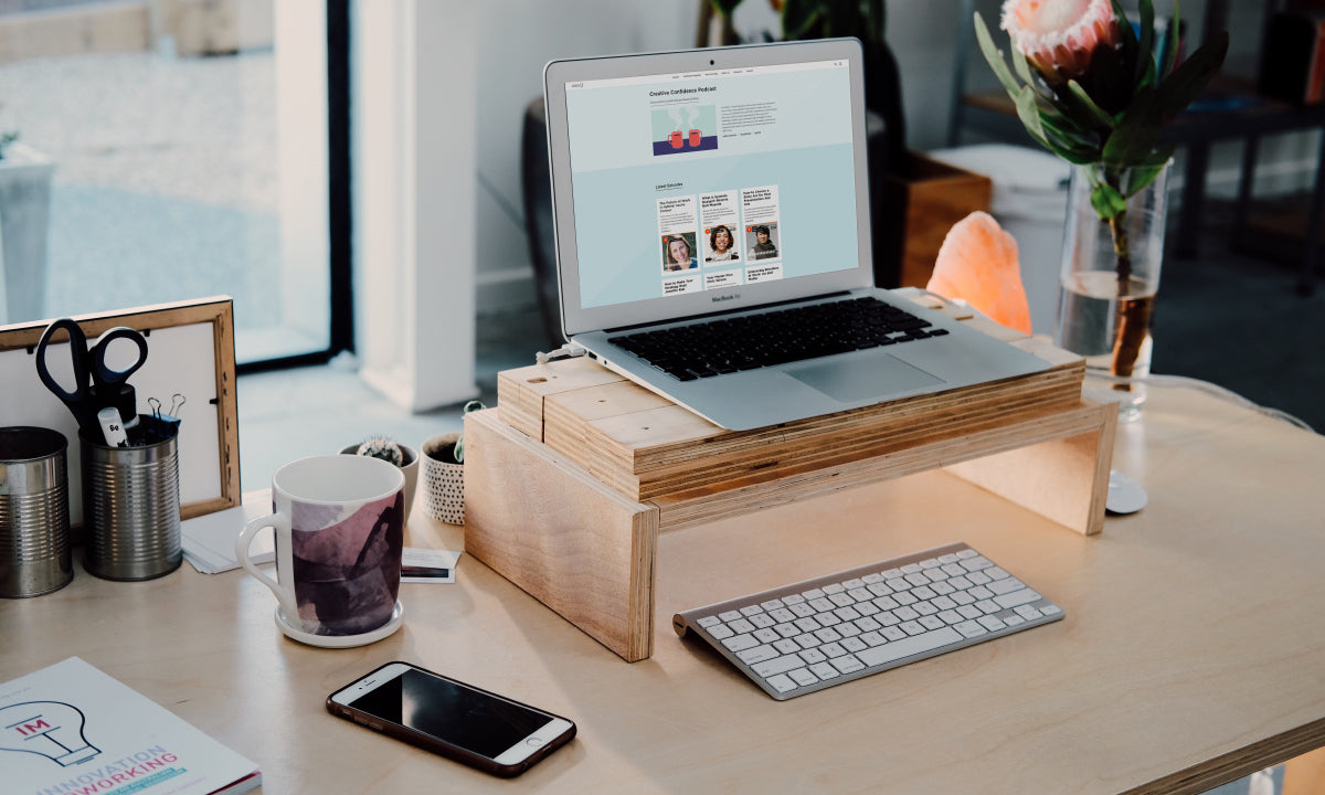 Work from home set-up, computer on stand, clean desk